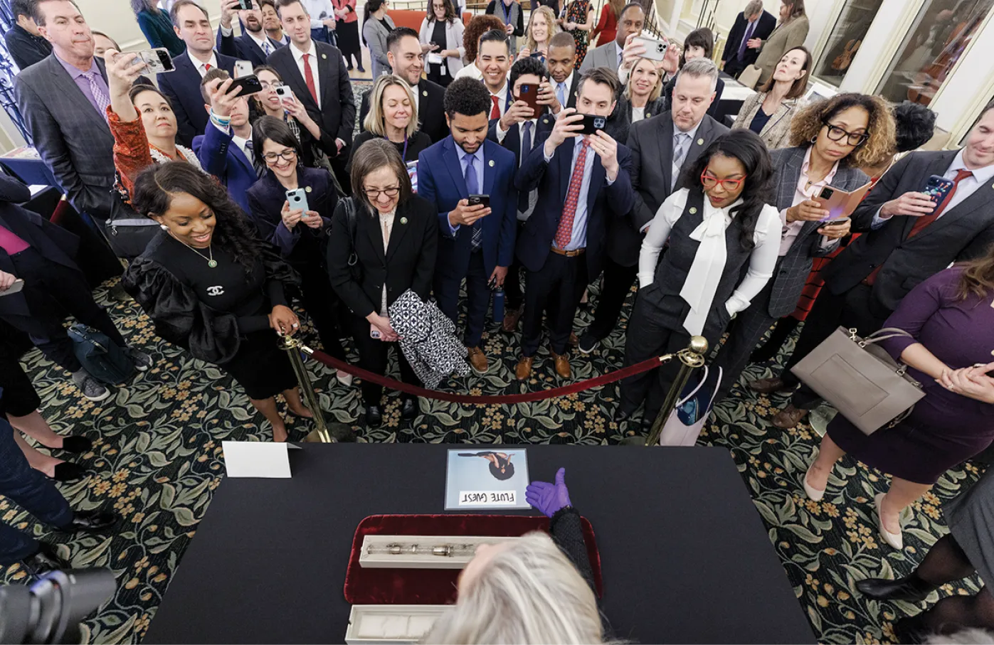 Democratic freshmen members of the House of Representatives examine the James Madison crystal flute at an event in the Jefferson Building. 